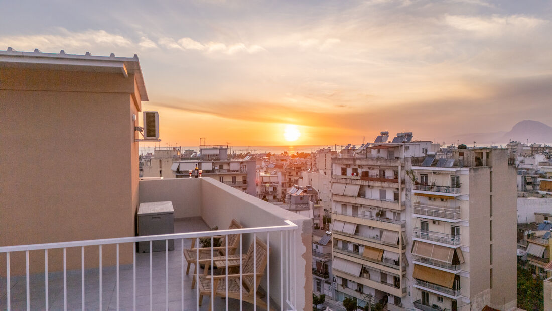 Sunset over Patra rooftops seen from the terrace