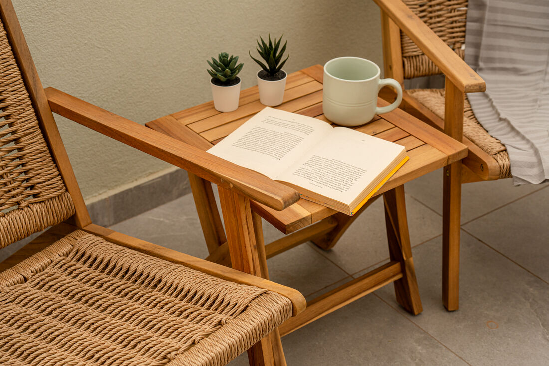Cozy terrace reading corner with coffee and a book