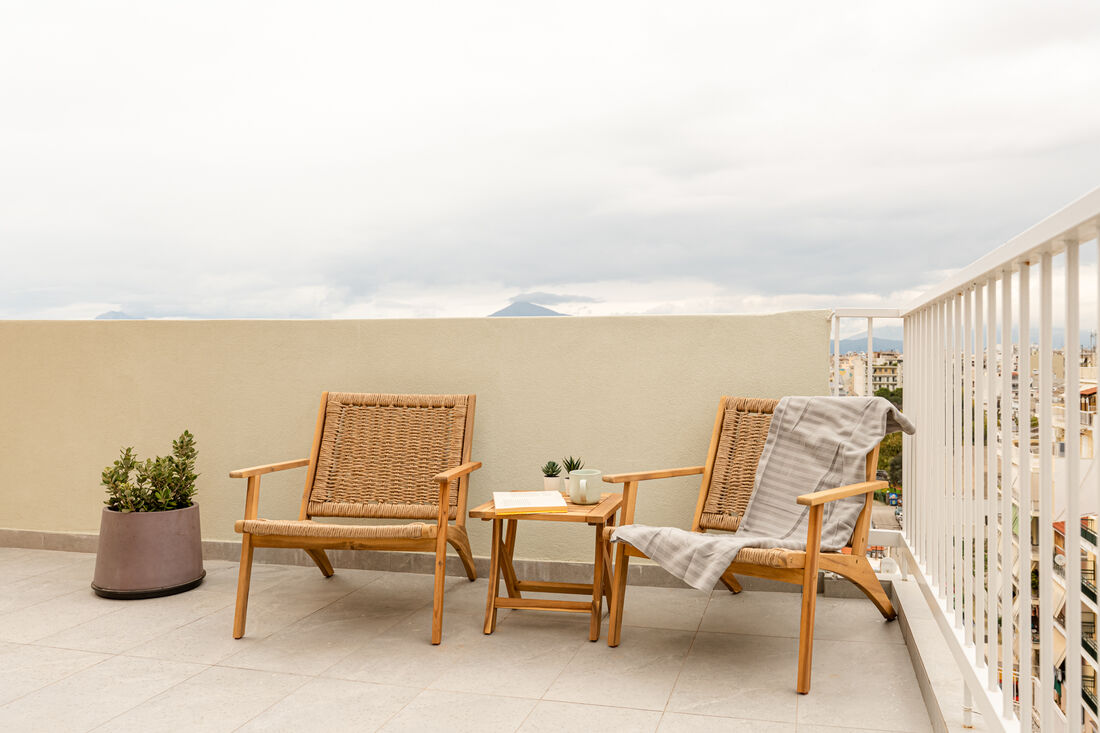 Private terrace lounge seating with mountain view
